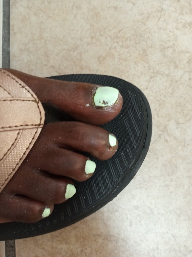 Acrylic and gel nail services in a salon interior.